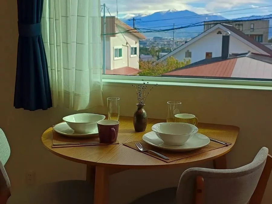 Dining table for two with a mountain view